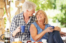 Older couple enjoying a romantic breakfast together