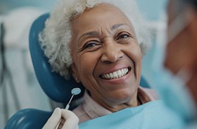 Happy older woman undergoing dental checkup