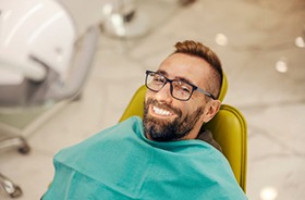 Dental receptionist talking on phone