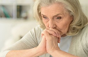 Close-up portrait of sad senior woman