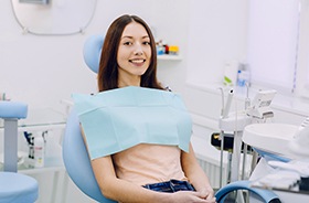 Happy dental patient in treatment chair