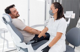 Dentist and patient having friendly conversation