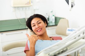 Happy patient making thumbs up gesture