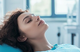 Dental patient relaxing with her eyes closed