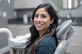 Happy, smiling woman in dental treatment chair